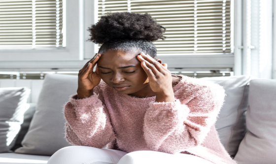 Stressed woman holding her torso