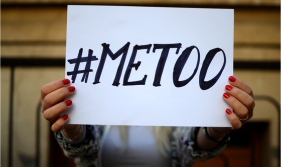 Image of woman holding up sign of #metoo campaign for harassment visability 