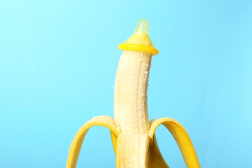 Condom worn on tip of peeled banana