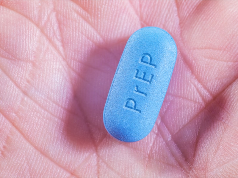 A blue PREP tablet on a palm