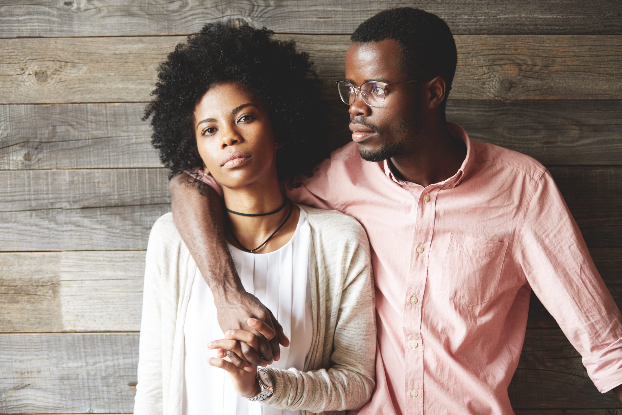 man holding woman standing next to him