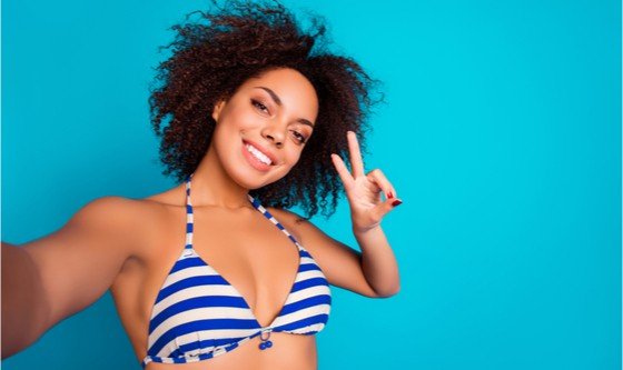 Happy young woman in a bikini top