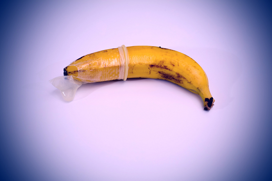 Broken condom put in a ripe banana halfway