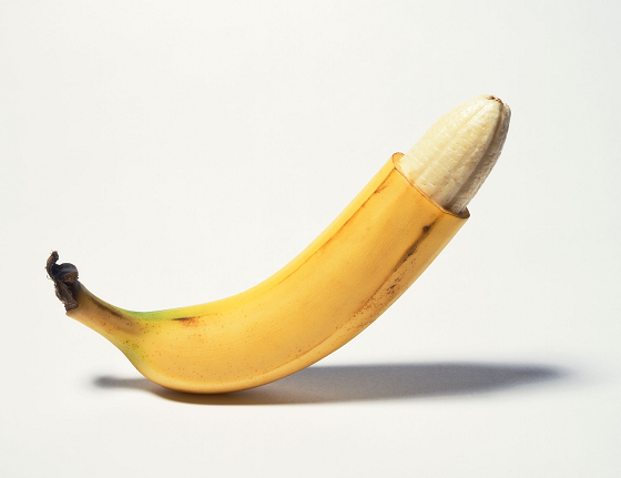 Ripe banana with pills cut off quarter way