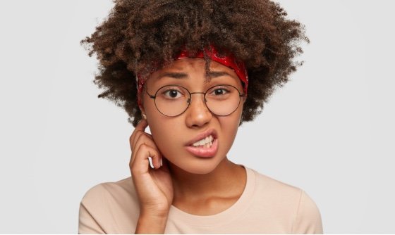 woman looking confused with her mouth sideways