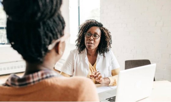 two women facing each other and having a conversation