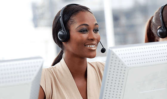 Helpline lady with phone headset on the job