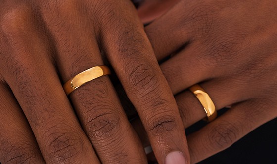 touching hands with wedding rings