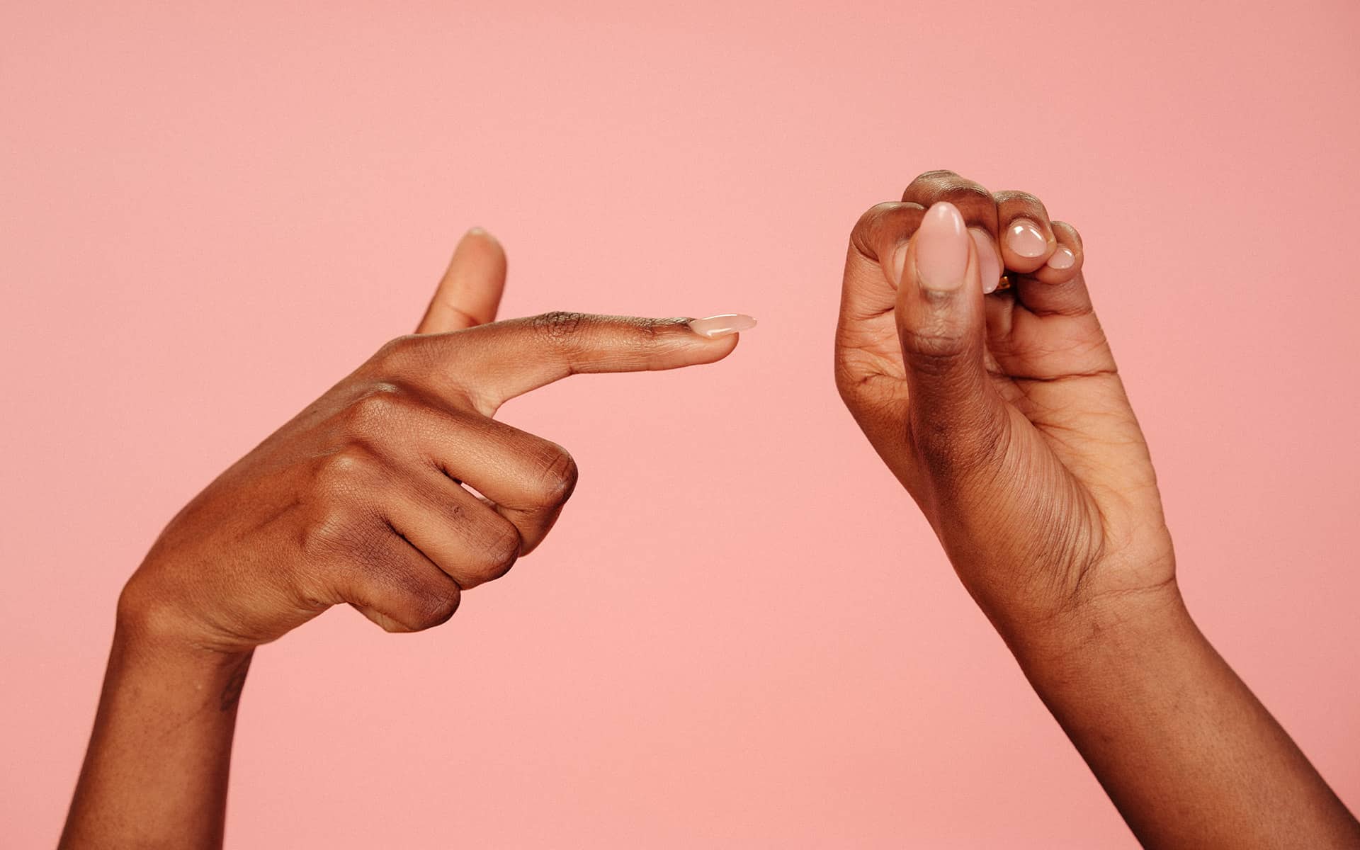 A finger pointing to a hole, to simulate a vagina or intercourse