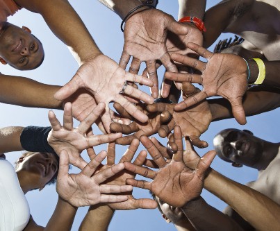 Many hands forming a circle