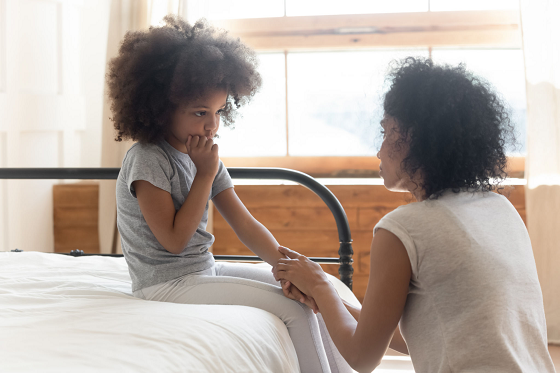 Woman talking to a young girl