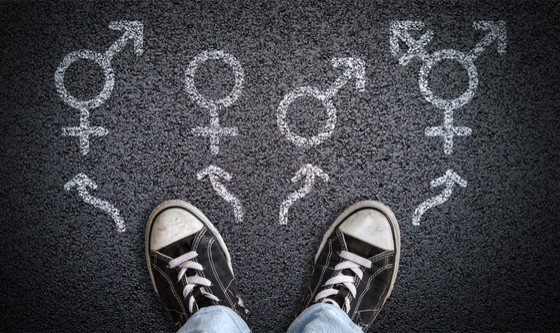 Shoes and gender sign on tarmac