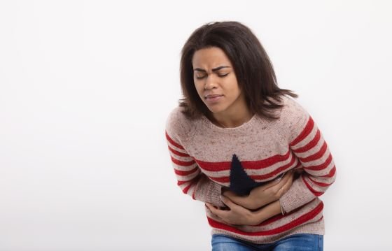 woman with abdominal pain hold stomach