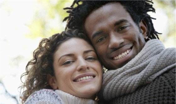 Closeup portrait of happy young multiethnic couple smiling