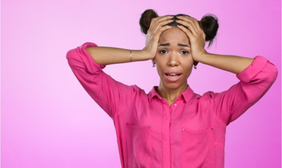 Closeup portrait of beautiful shocked young woman