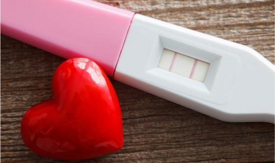 Positive pregnancy test with a heart 