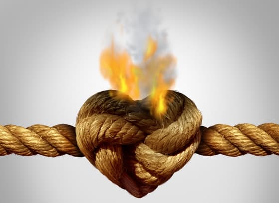 a rope with a burning knot shaped as a love heart