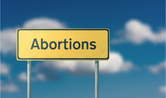 Street sign with the word abortion on it 