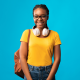 young woman with headphones around the neck