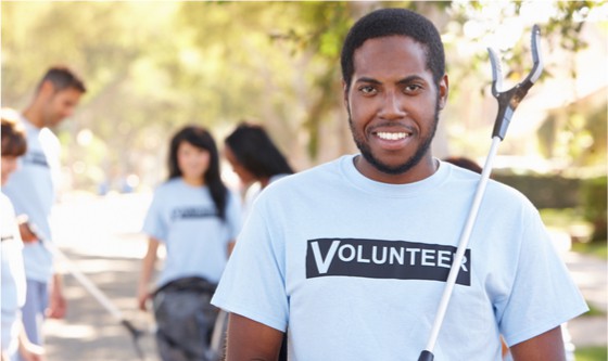 Attractive young man wearing volunteer t-shirt