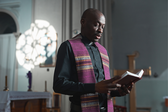 pastor reading the bible 