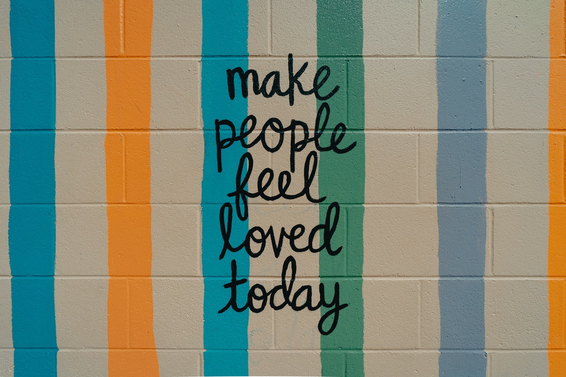 A graphic that says 'make people feel loved today'