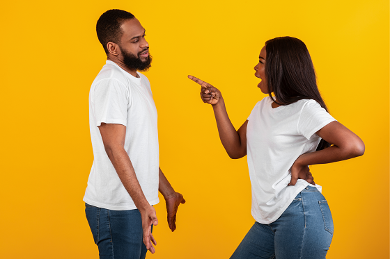 angry woman pointing at man