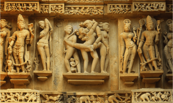 Wooden Kamasutra carvings on a Hindu temple