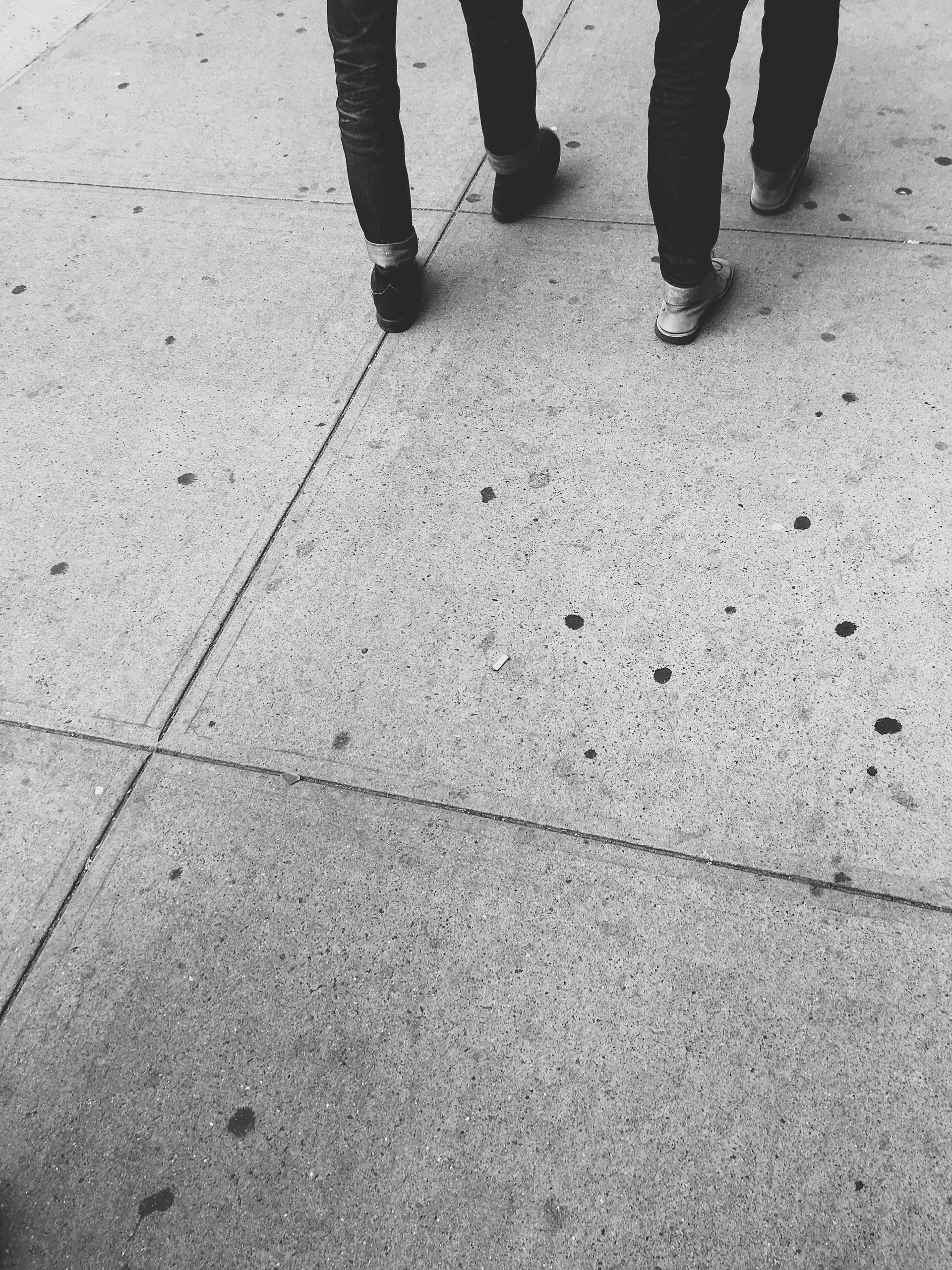 Two sets of feet walking away