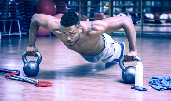 Man working out with kettlebells
