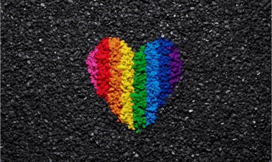 Rainbow heart on black gravel 