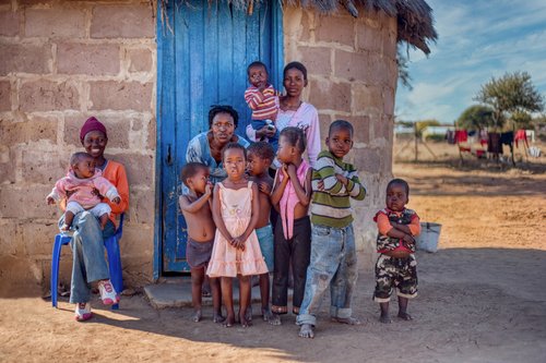 African kids and mother in a village