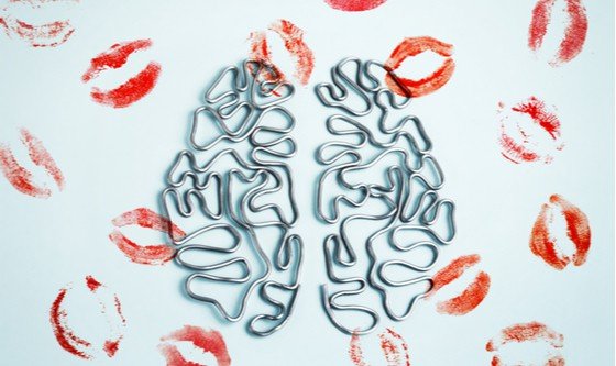 A wire graphic of a brain with lipstick prints all over it in the shape of kisses