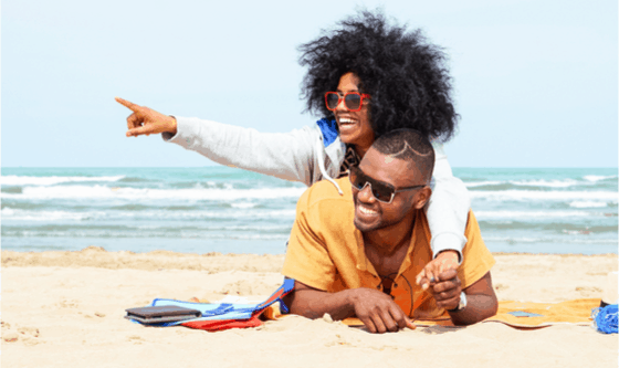 Two happy people on the beach