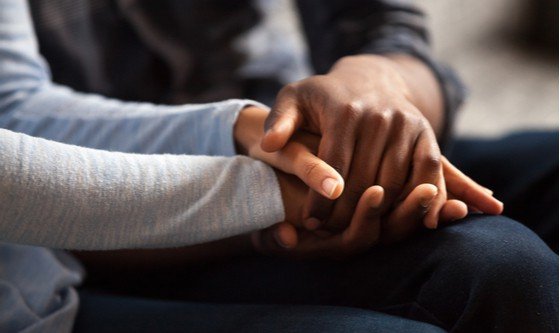black man and woman holding hands