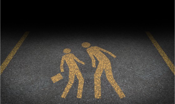 Big bully and bullying concept as yellow painted road sign on asphalt with an abusive bully attacking another person as a symbol of being bullied and the social issues of human abuse and fear