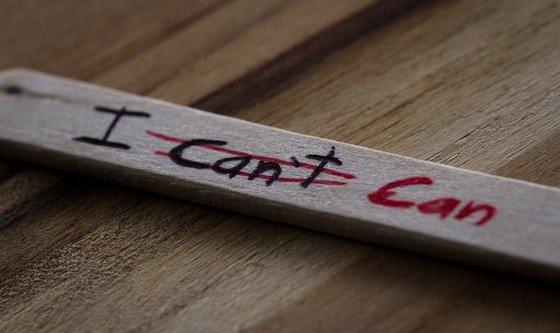 close up of a hand written message on a popsicle stick as a self esteem building concept