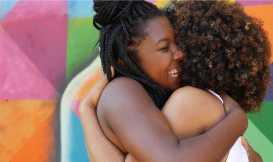 Two women hugging 