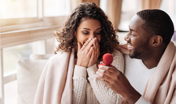 Man proposing to his happy girlfriend 