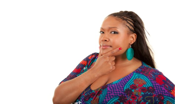 Larger woman looking into the camera with a questioning look on her face