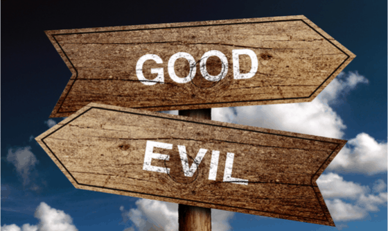 Signboards good and evil pointing in different directions 