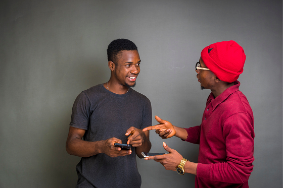 two young men talking 