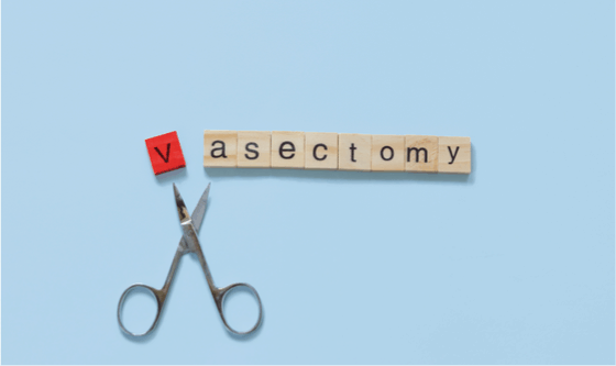 Pair of scissors cutting V from the word vasectomy 
