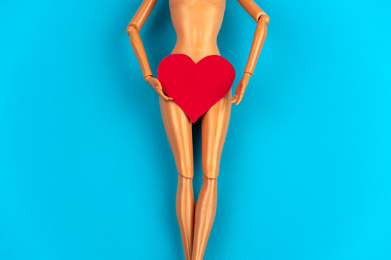 a mannequin with red heart shape around the pubic area