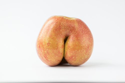 Red apple in the shape of human butt