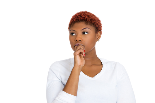 woman with finger in mouth, sucking thumb, biting fingernail in stress, deep thought, isolated on white background