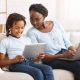 Black mother watching her daughter's activity online