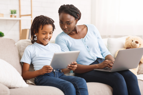 Black mother watching her daughter's activity online