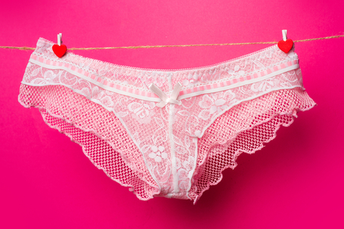 Pink female panties on clothesline