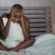 Young,Sad,And,Depressed,Black,Afro,American,Woman,In,Bed